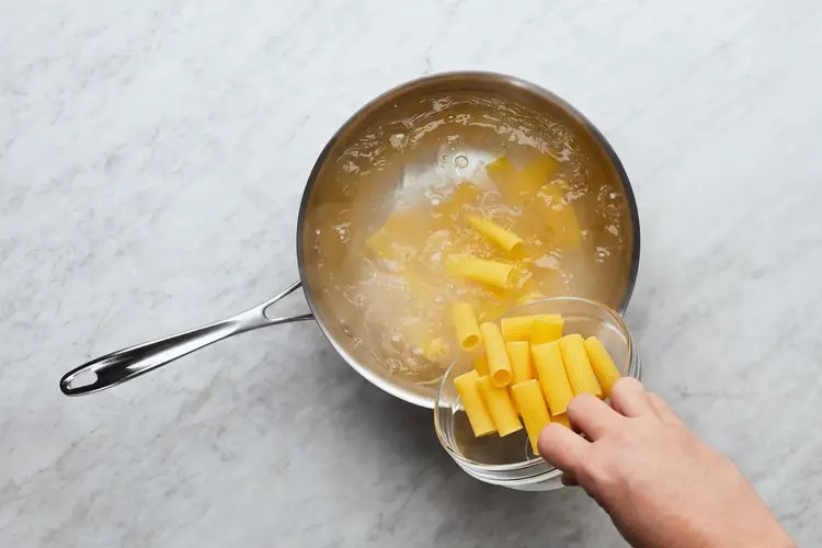 Roasting chicken and boiling rigatoni